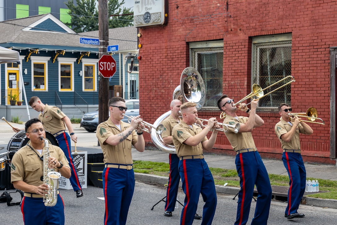 U.S. Marines assigned to Marine Forces Reserve Brass Band perform at the Lyons Street Fest, New Orleans, May 18, 2024. The Lyons Street Fest was hosted by the Veterans of Foreign Wars Post 8973 and supported local dog adoptions from around the New Orleans area. (U.S. Marine Corps photo by Lance Cpl. Michael Chaney)