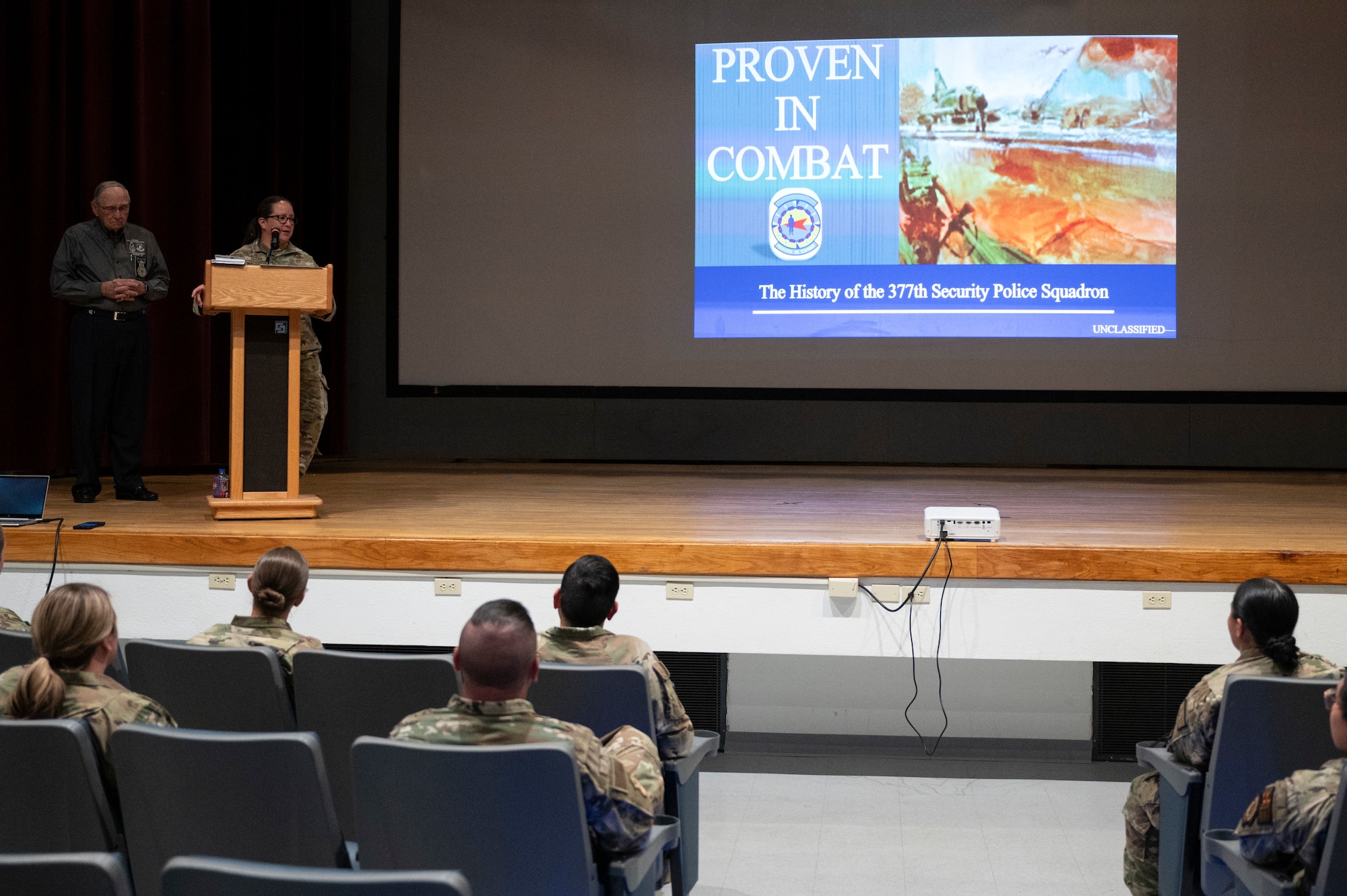 A man presents to a crowd.