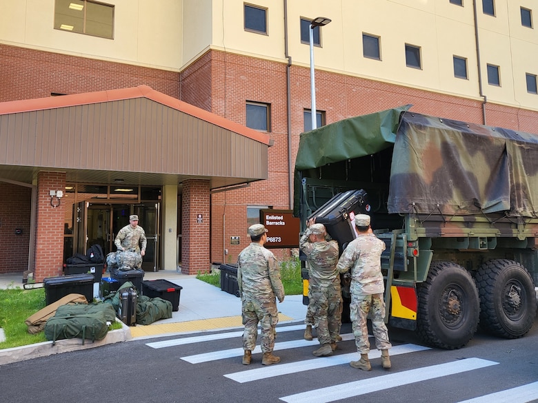 Soldiers move their belongings into a new barracks building on U.S. Army Garrison Humphreys, May 31, 2024. They bring their personnel items and equipment to their rooms, which have shared kitchens and bathrooms for every two Soldiers, along with four gazebos and a barbecue shelter outside. (US Army photo by Kim Chong-yun)