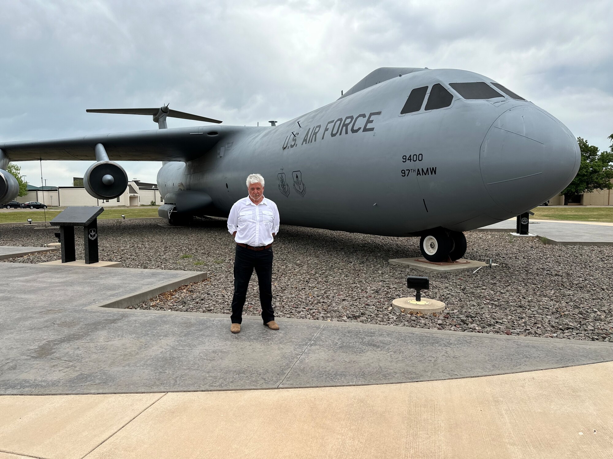 Retired U.S. Air Force Lt. Col. Herbert Bailey poses in front of a static C-141 Starlifter aircraft at Altus Air Force Base, Oklahoma, April 15, 2024. Bailey served as a C-141 pilot during his time in the Air Force. (U.S. Air Force photo by Nicole Valence)