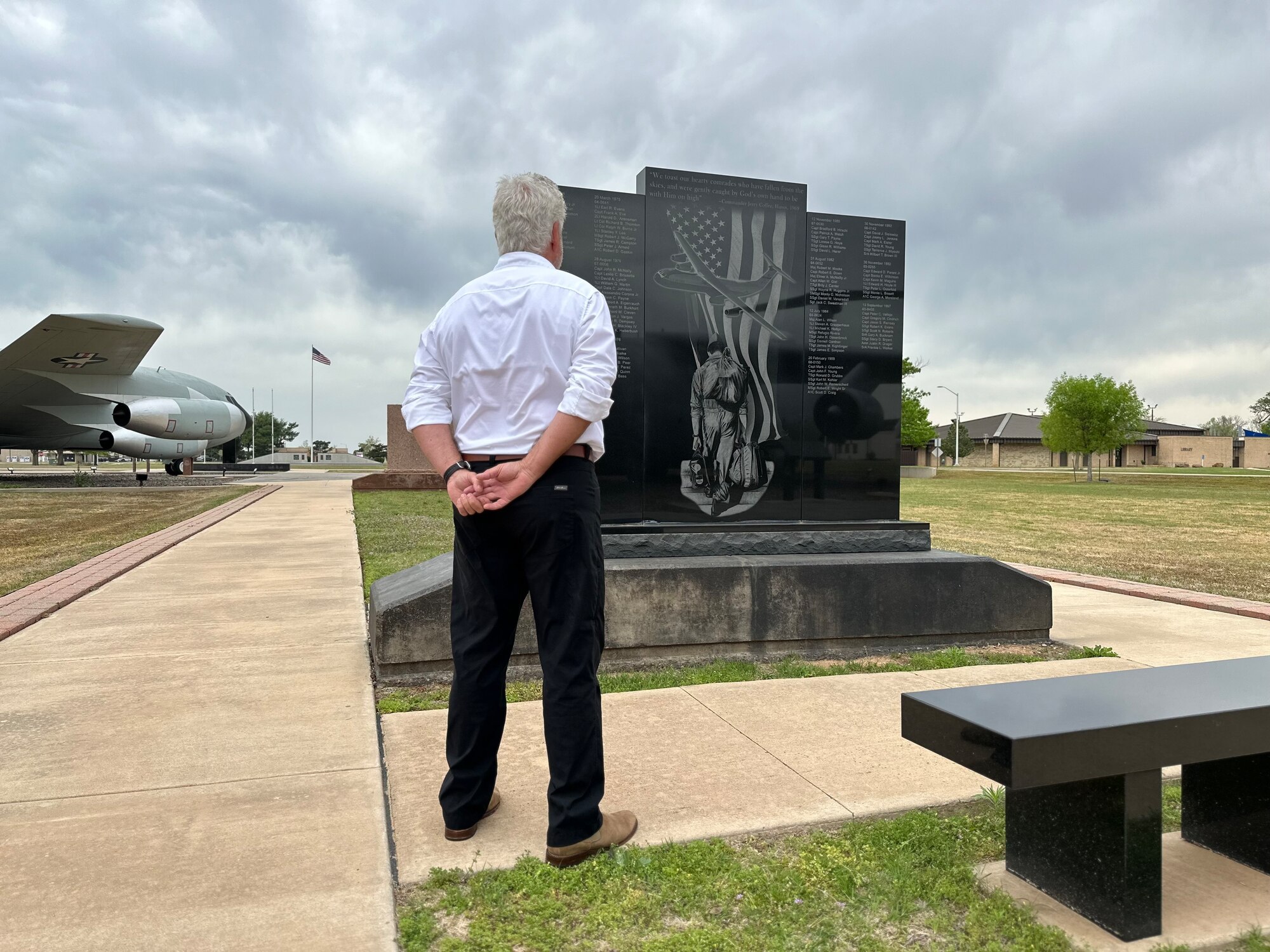 Retired U.S. Air Force Lt. Col. Herbert Bailey views the C-141 Starlifter aircraft memorial at Altus Air Force Base, Oklahoma, April 15, 2024. Bailey’s artwork- “The Last Bag Drag”- is depicted on the memorial. (U.S. Air Force photo by Nicole Valence)