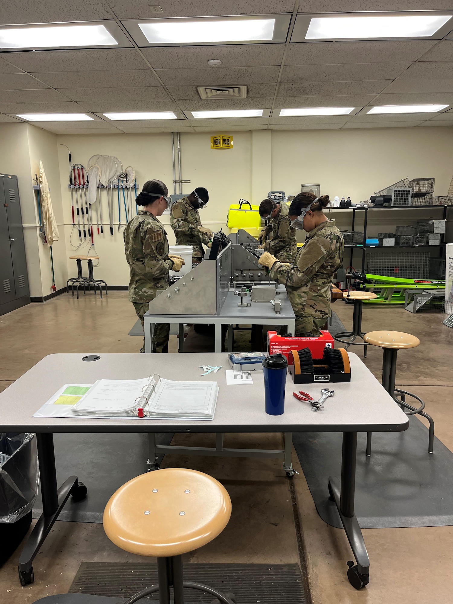 Airmen in Training work on equipment