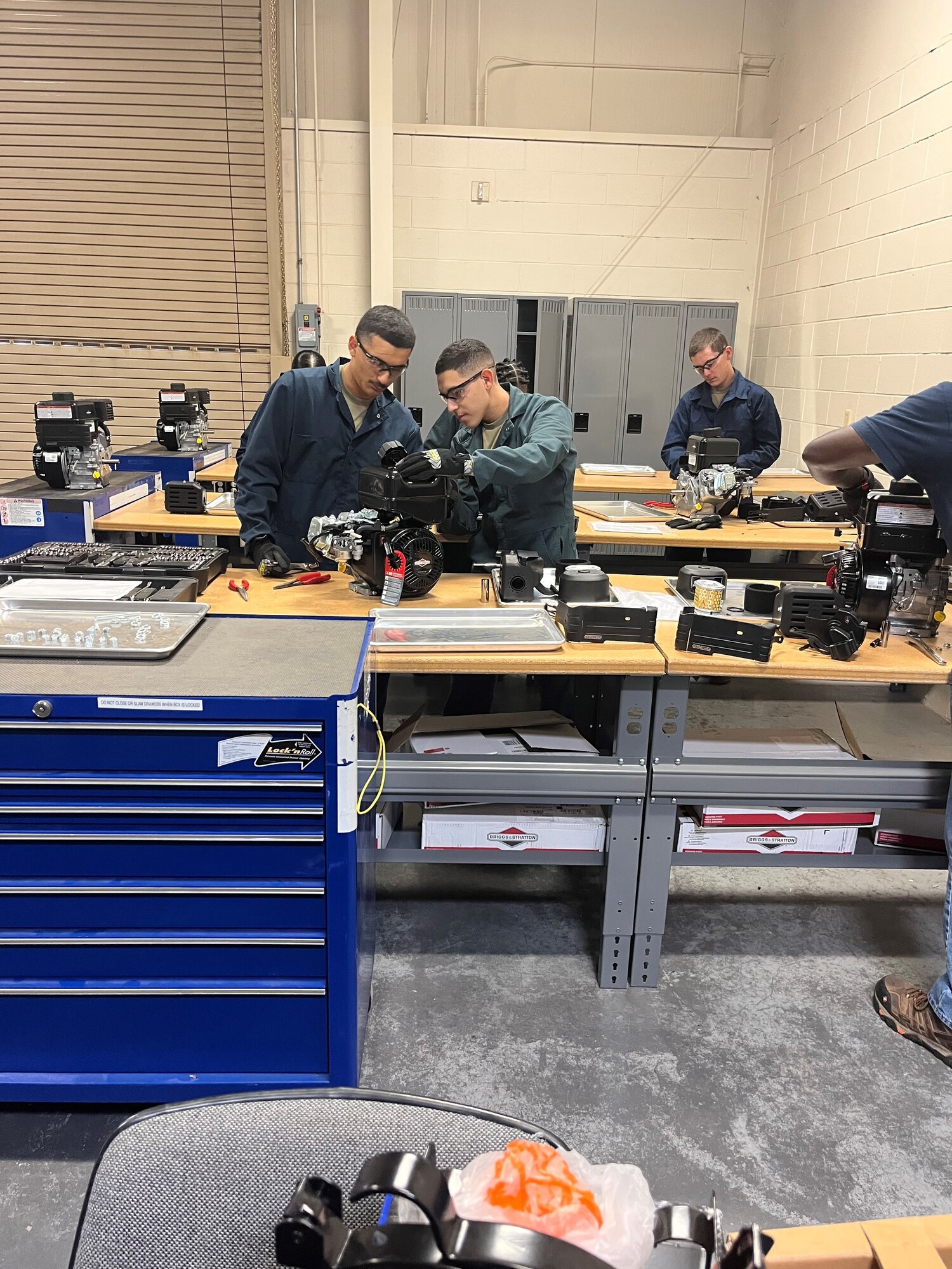 Airmen in Training work on equipment