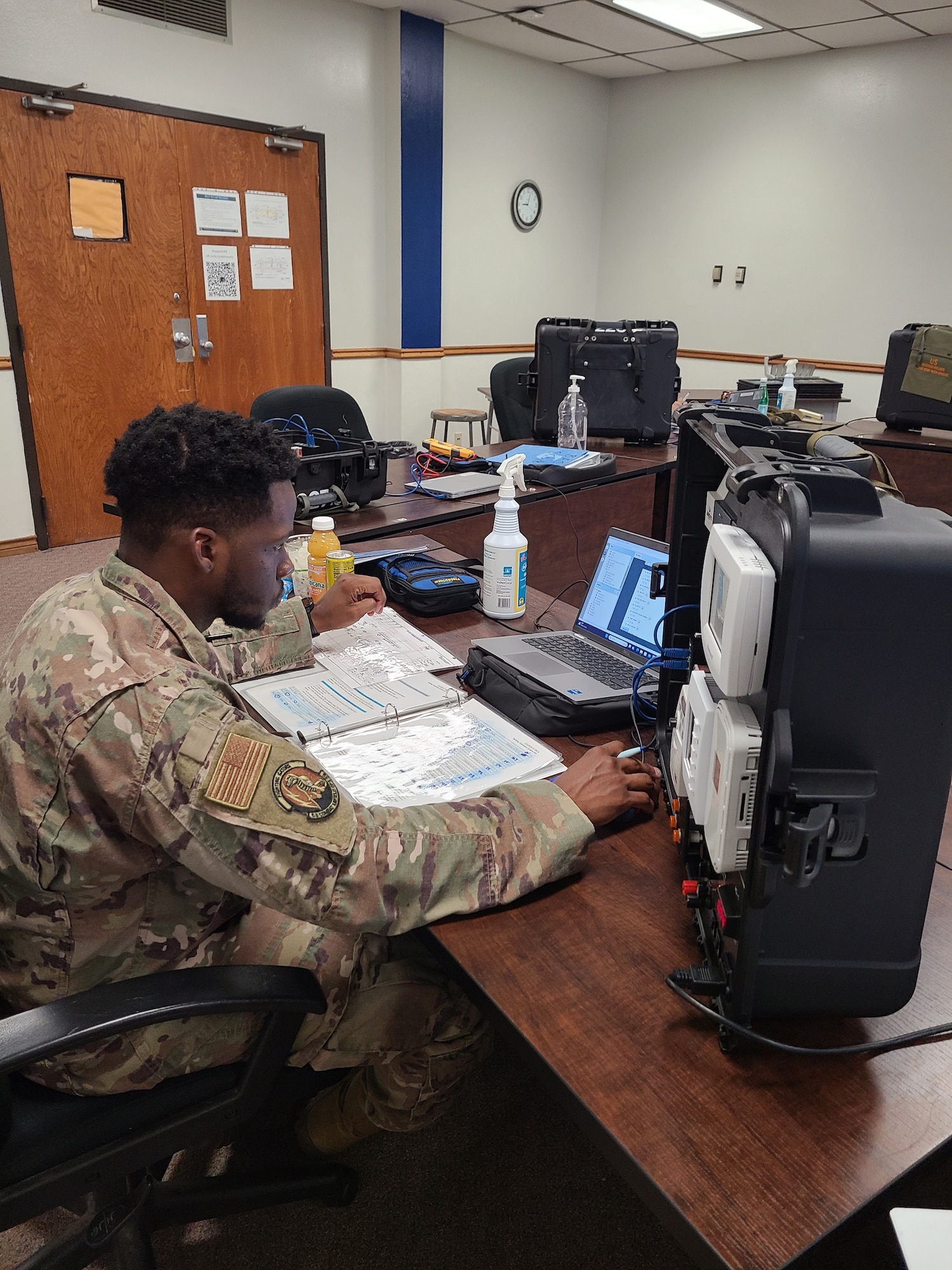Airmen in Training work on equipment