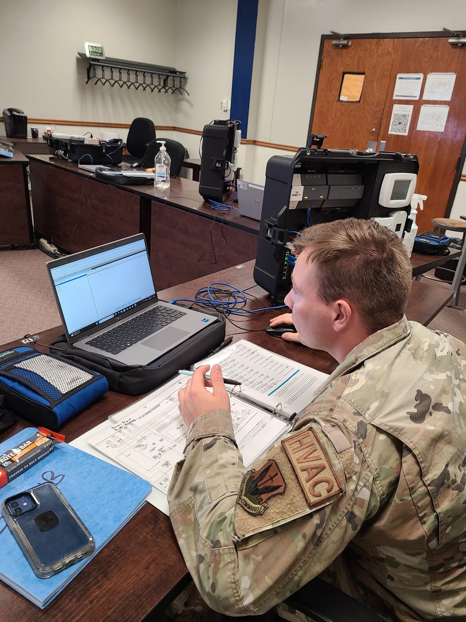 Airmen in Training work on equipment