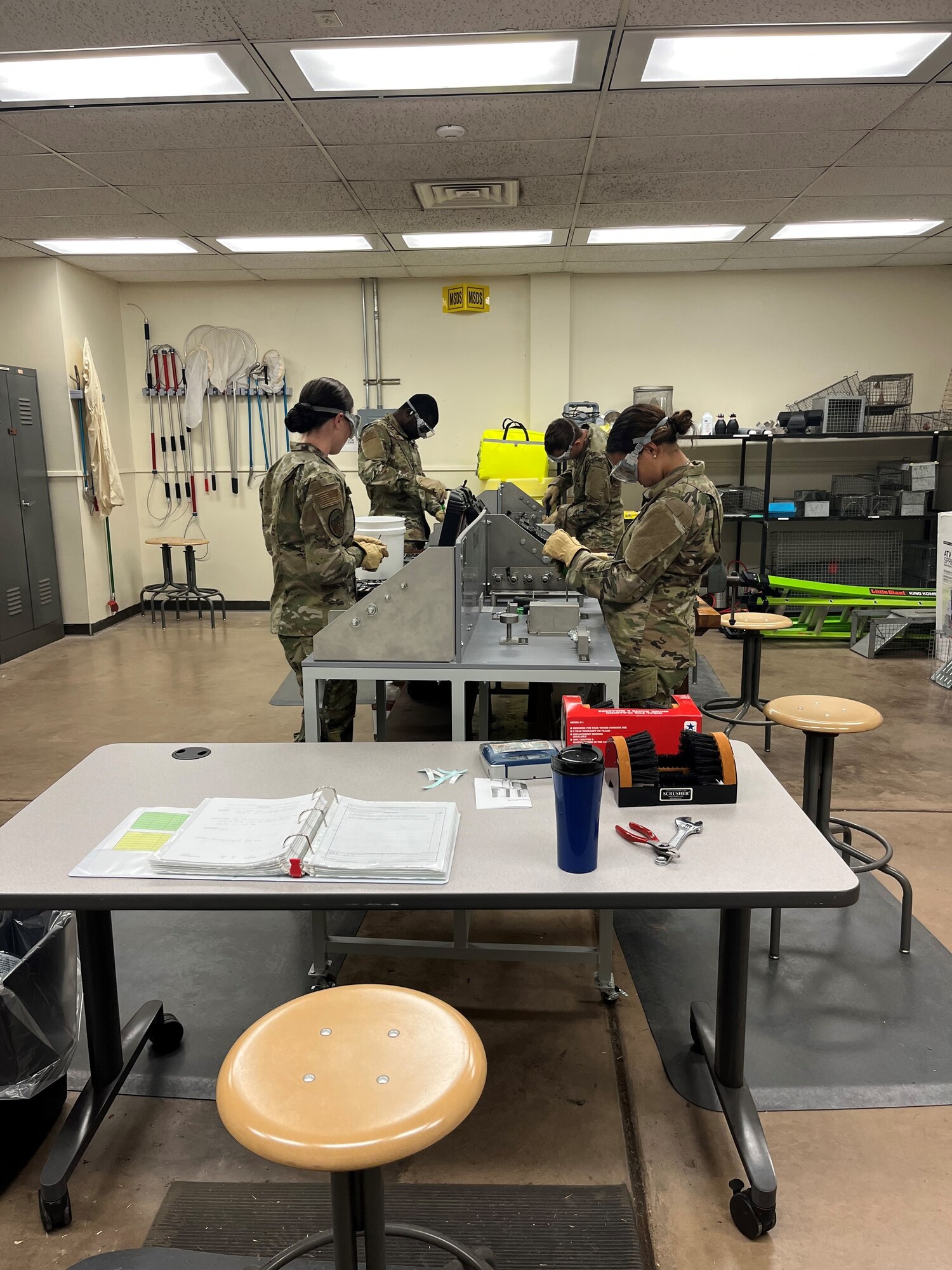 Airmen in Training work on equipment