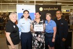 Caryl Hill, Employer Support of the Guard and Reserve Southern Region director, Senior Airman Arthur Tovar, 433rd Civil Engineer Squadron Air Force Reservist, Ms. Nancy Olguin, Sunglass Hut manager, Ms. Kerry Reyna, ESGR Awards Team Leader and Mr. Sergio Hernandez, Sunglass Hut manager, gather April 19, 2024 after Olguin receives the Seven Seals Award.