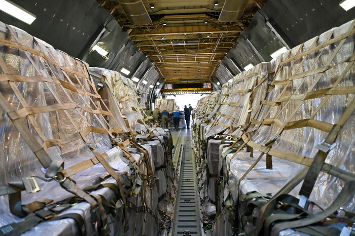 68th Airlift Squadron loadmasters and Panamanian airport workers unload pallets of humanitarian aid from a 433rd Airlift Wing C-5M Super Galaxy at Panama Pacifico International Airport June 1, 2024.