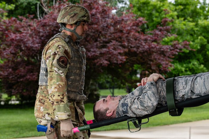 Airman loads simulated patient.