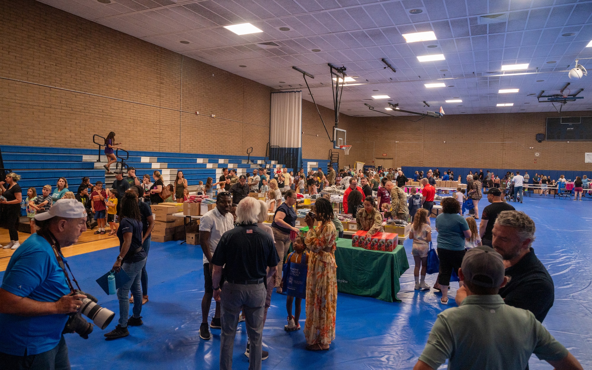 Airmen and families gather during a Back-to-School Bash event June 1, 2024, at Luke Air Force Base, Arizona.