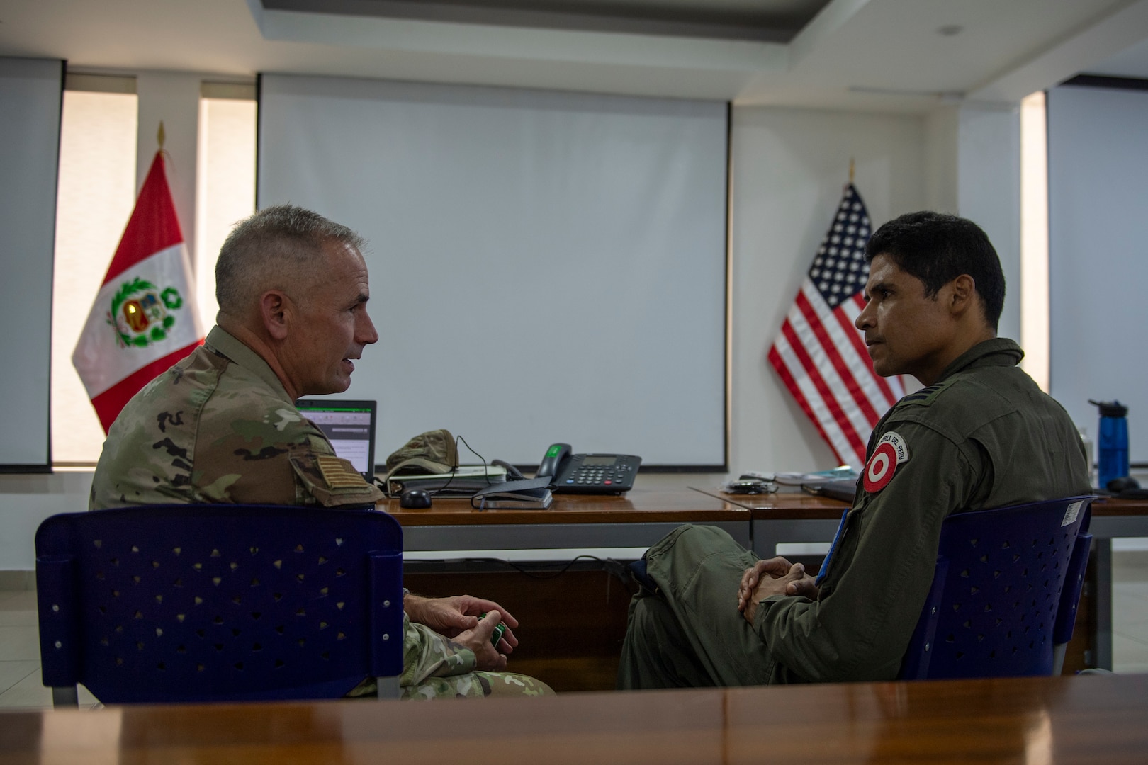 U.S. Air Force Col. Barton Kenerson, Combined Joint Task Force – Resolute Sentinel 2024 commander, left, and Peruvian Air Force Col. Fidel Castro, CJTF – RS24 deputy commander, exchange ideas at task force headquarters in Lima, Peru, May 30, 2024. Resolute Sentinel 24 is a multi-national training opportunity that offers real-world benefits to U.S. and partner nation military personnel and the people of the participating countries by promoting collaboration and readiness in addition to building long-term partnerships. (U.S. Air Force photo by Andrea Jenkins)