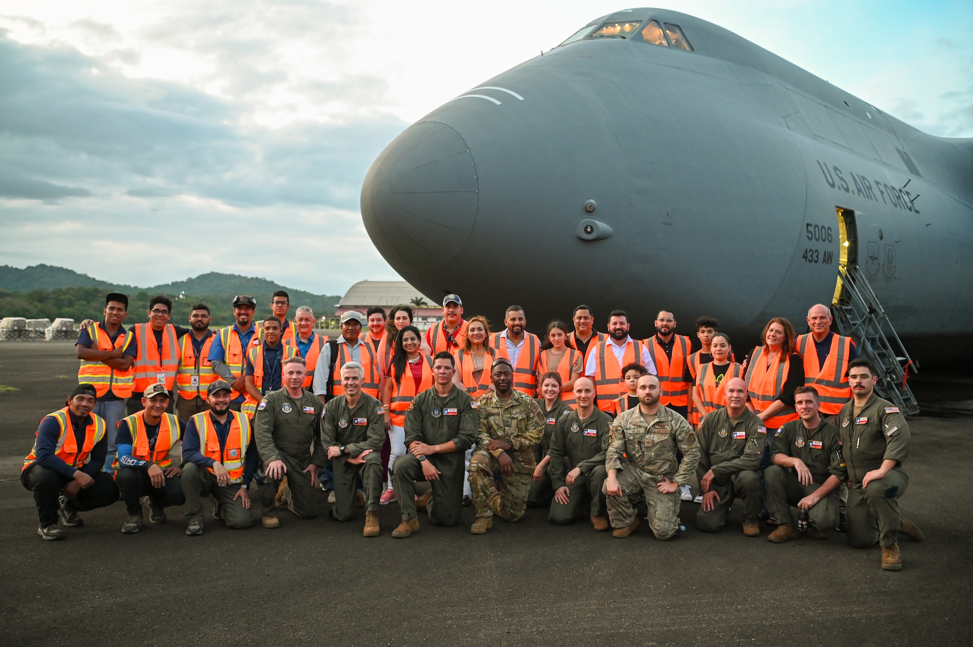 The 68th Airlift Squadron crew, call sign “Reach 2087”, which delivered 166,000 pounds of humanitarian aid to Panama pose for a group photo with members of King’s Castle Foundation (Fundación Castillo Del Rey), a Panamanian non-governmental organization distributing the aid to those in need, on the tarmac at Panama Pacifico International Airport June 1, 2024.