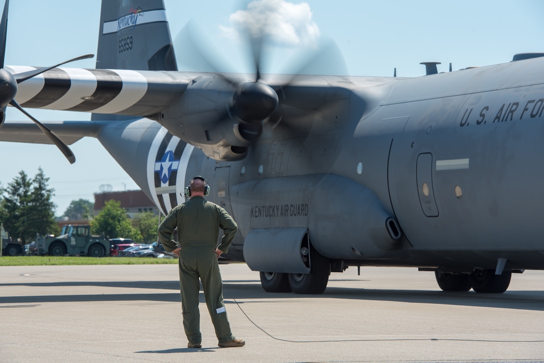 A C-130J Super Hercules from the 123rd Airlift Wing awaits take off at the Kentucky Air National Guard Base in Louisville, Ky., May 21, 2024, bearing the distinctive livery displayed on U.S. aircraft during World War II. The plane will fly over France on June 6 as part of observances for the 80th anniversary of D-Day, when Allied forces invaded Normandy to turn the tide of the war in Europe. (U.S. Air National Guard photo by Airman 1st Class Annaliese Billings)