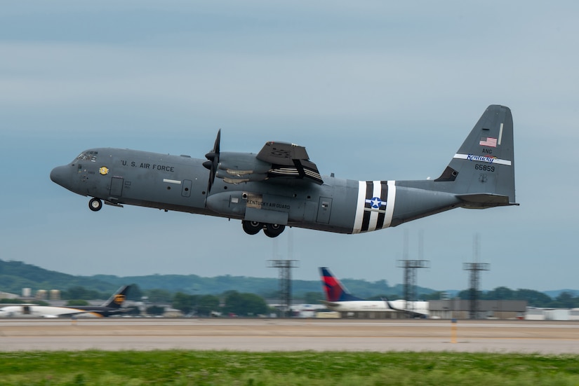 A C-130J Super Hercules assigned to the 123rd Airlift Wing takes off from the Kentucky Air National Guard Base in Louisville, Ky., May 22, 2024, bearing the distinctive livery displayed on U.S. aircraft during World War II. The plane will fly over France on June 6 as part of observances for the 80th anniversary of D-Day, when Allied forces invaded Normandy to turn the tide of the war in Europe. (U.S. Air National Guard photo by Phil Speck)