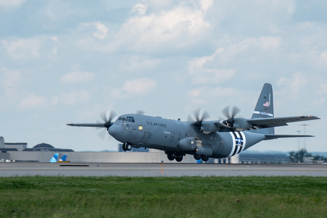 A C-130J Super Hercules assigned to the 123rd Airlift Wing takes off from the Kentucky Air National Guard Base in Louisville, Ky., May 22, 2024, bearing the distinctive livery displayed on U.S. aircraft during World War II. The plane will fly over France on June 6 as part of observances for the 80th anniversary of D-Day, when Allied forces invaded Normandy to turn the tide of the war in Europe. (U.S. Air National Guard photo by Phil Speck)