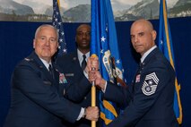 Chief Master Sgt. Manuel R. Zubia, Headquarters Air Reserve Personnel Center incoming command chief, assumes command chief responsibilities from Col. Jason Knight, HQ ARPC deputy commander, during a Change of Responsibility ceremony on Buckley Space Force Base, Colorado, May. 30, 2024.