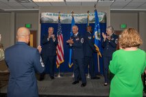Members of Headquarters Air Reserve Personnel Center congratulate Command Chief Master Sgt. Manuel R. Zubia, HQ ARPC command chief, during a Change of Responsibility ceremony on Buckley Space Force Base, Colorado, May. 30, 2024.