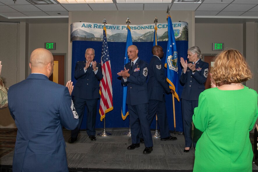 Members of Headquarters Air Reserve Personnel Center congratulate Command Chief Master Sgt. Manuel R. Zubia, HQ ARPC command chief, during a Change of Responsibility ceremony on Buckley Space Force Base, Colorado, May. 30, 2024.