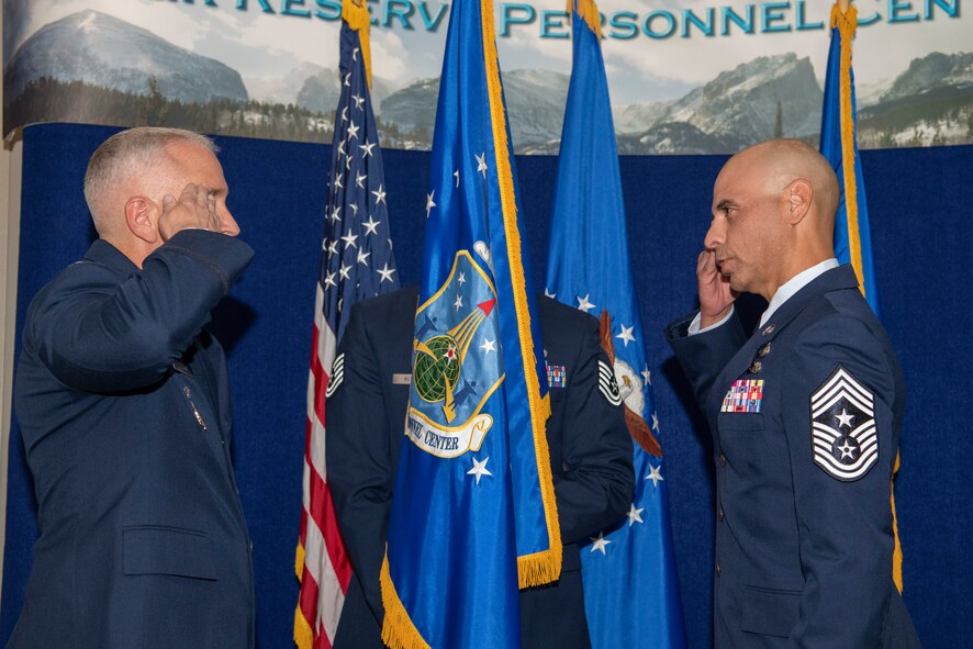 Command Chief Master Sgt. Manuel R. Zubia, Headquarters Air Reserve Personnel Center command chief, salutes Col. Jason Knight, HQ ARPC deputy commander, during a Change of Responsibility ceremony on Buckley Space Force Base, Colorado, May. 30, 2024