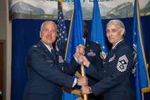 Chief Master Sgt. Vicki L. Robertson, Headquarters Air Reserve Personnel Center outgoing command chief, relinquishes command chief responsibilities from Col. Jason Knight, HQ ARPC deputy commander, during a Change of Responsibility ceremony on Buckley Space Force Base, Colorado, May. 30, 2024.
