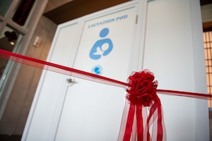 a red ribbon hangs tied in front of a lactation pod
