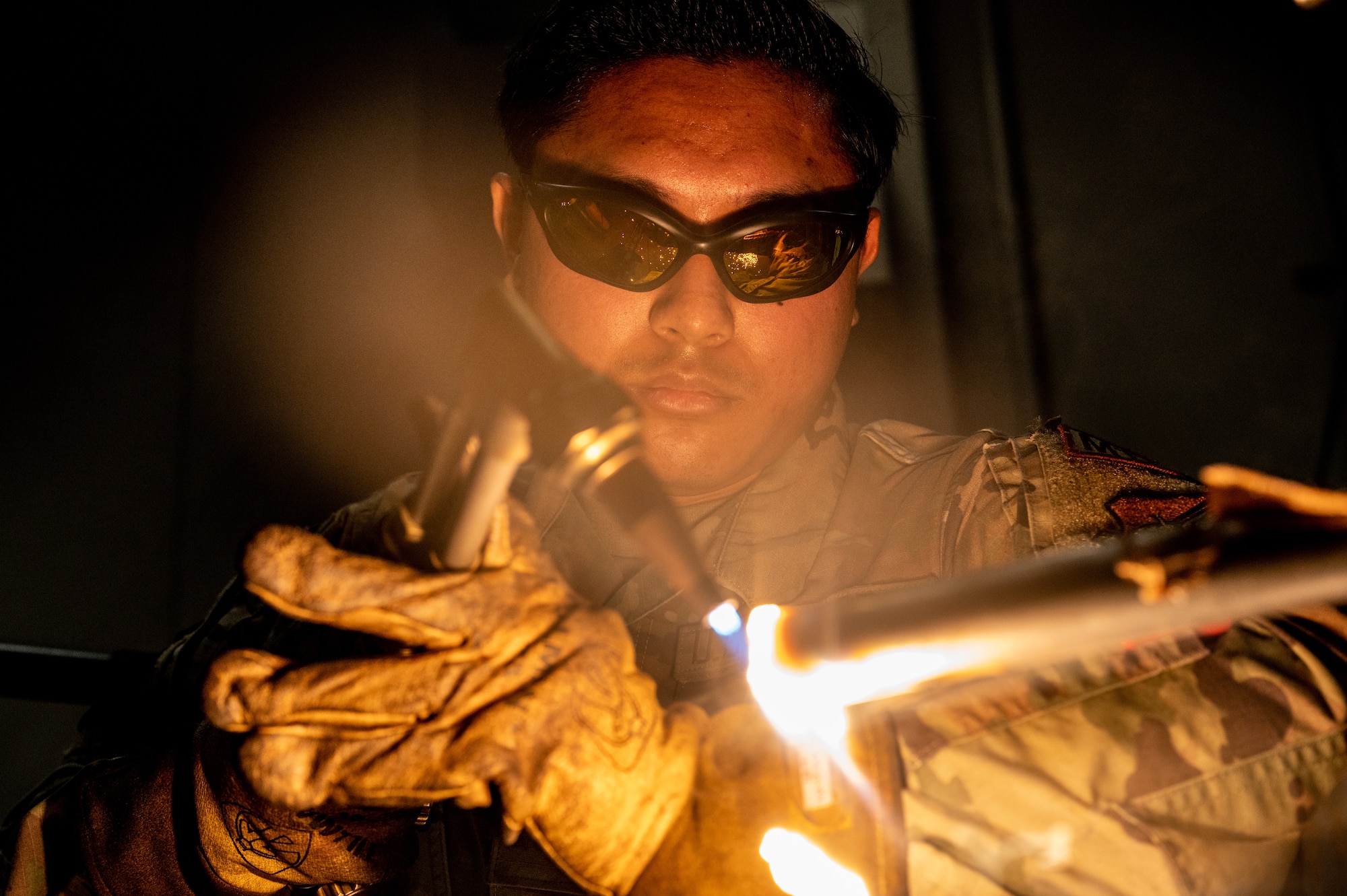 U.S. Air Force Senior Airman William Andres, 35th Maintenance Squadron metals technology journeyman, cuts a metal bar with a welding machine at Misawa Air Base, Japan, May 28, 2024.