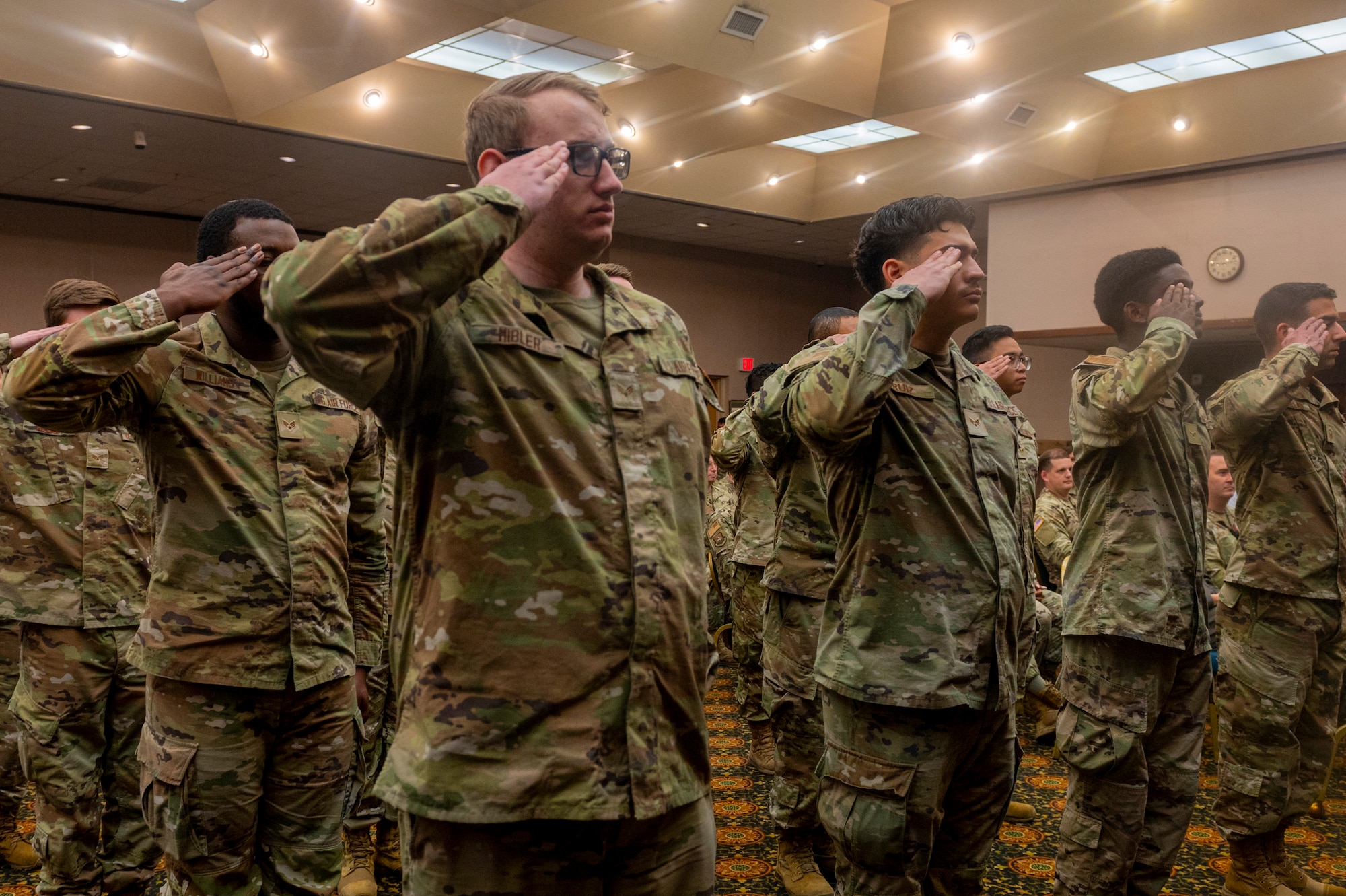 U.S. Air Force Airmen assigned to the 51st Comptroller Squadron render their first salute to Maj. Clayton Sharum, 51st CPTS commander, during the 51st CPTS Change of Command ceremony at Osan Air Base, Republic of Korea, June 4, 2024. A change of command ceremony, which dates back as far as the Roman empire, marks the transition of responsibility from one military leader to another into a real, tangible act, solidifying the continuity of leadership and affirming the formal nature of professional military service for all present. (U.S. Air Force photo by Senior Airman Kaitlin Frazier)