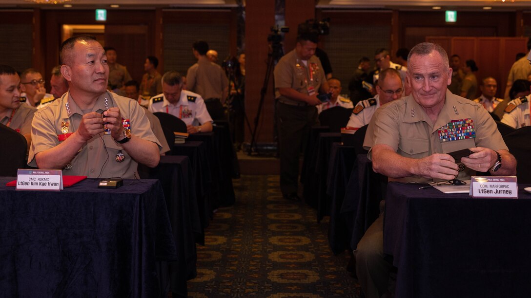 Republic of Korea Marine Corps Commandant Lt. Gen. Kim Kye-Hwan, left, and U.S. Marine Corps Lt. Gen. William M. Jurney, commander, U.S. Marine Corps Forces, Pacific, await the commencement for the closing ceremony of the 10th iteration of the Pacific Amphibious Leaders Symposium, Seoul, South Korea, June 5, 2024. PALS brings together experts and leaders from across the Indo-Pacific to foster collaboration among Allied and partner amphibious and maritime forces, sharing knowledge and recent operational insights. This year's symposium hosts senior leaders from 24 participating nations who are committed to a free and open Indo-Pacific, with the objective of strengthening and developing regional relationships. (U.S. Marine Corps photo by Lance Cpl. Matthew Benfield)