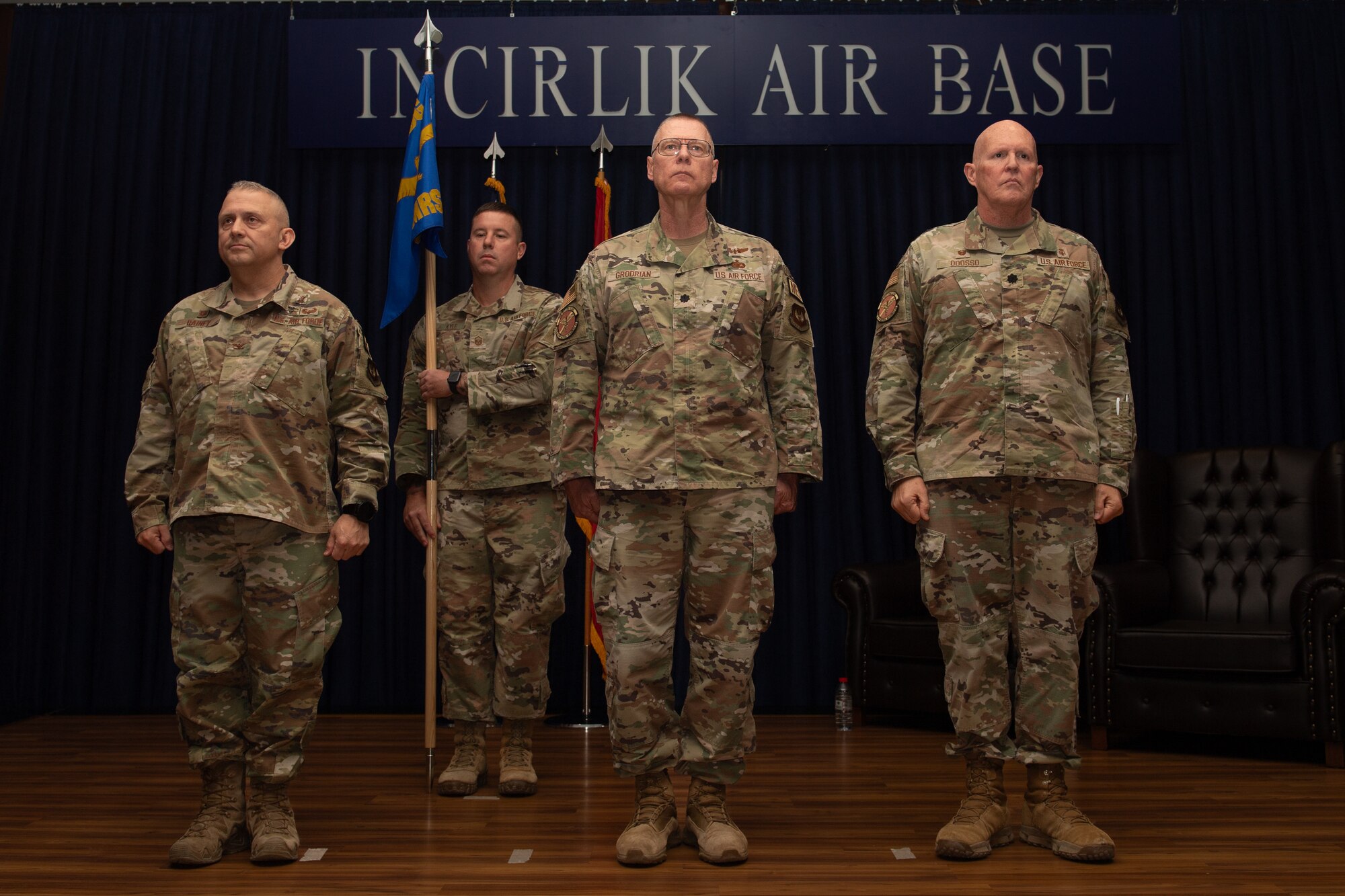Leadership from the 39th Medical Group stand at attention during the 39th Operational Medical Readiness Squadron change of command ceremony.