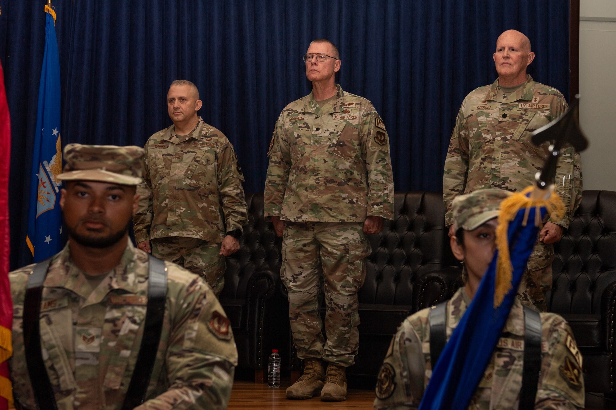 Leadership from the 39th Medical Group stand at attention during the 39th Operational Medical Readiness Squadron change of command ceremony.