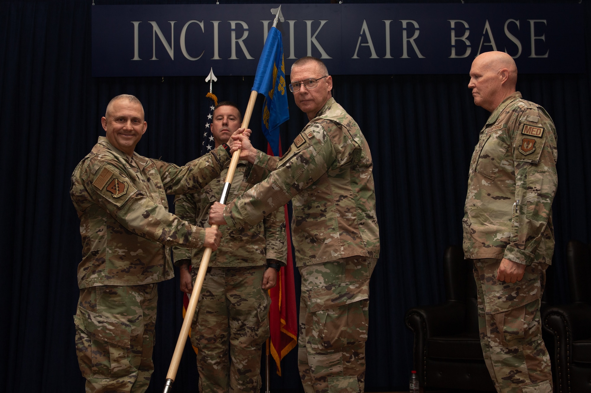 U.S. Air Force Col. Robert Rainey, 39th Medical Group commander, receives the guidon from Lt. Col. Stanley Grodrian, 39th Operational Medical Readiness Squadron commander, during a change of command ceremony.