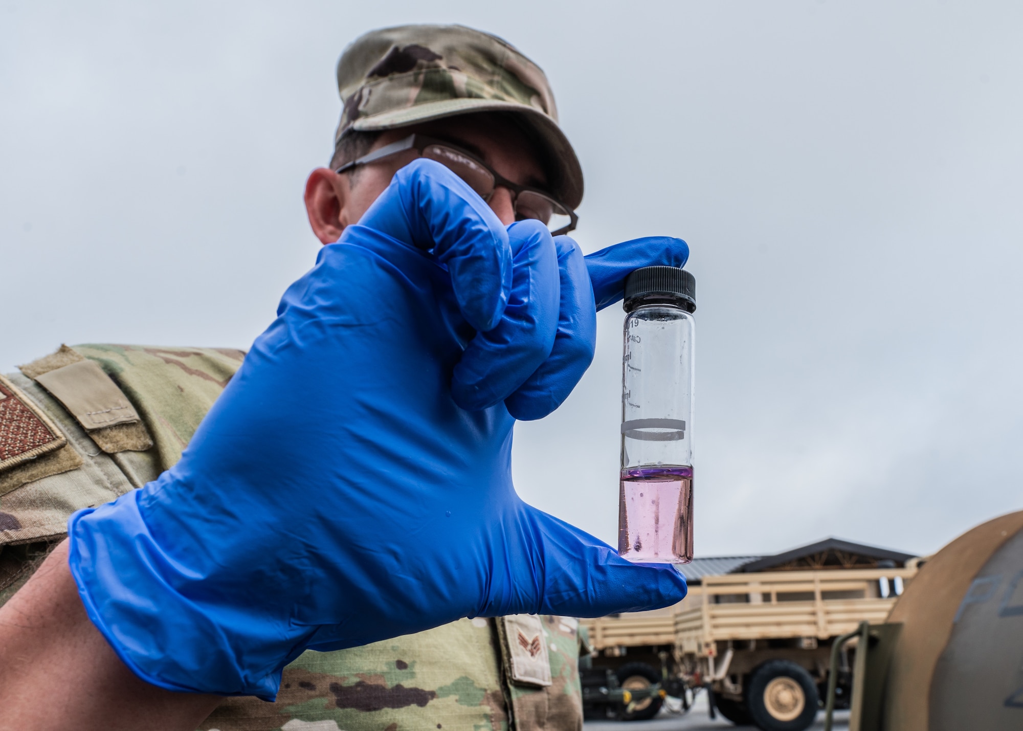a bioenvironmental engineering technician observes a water sample for color change after applying chlorine reagent
