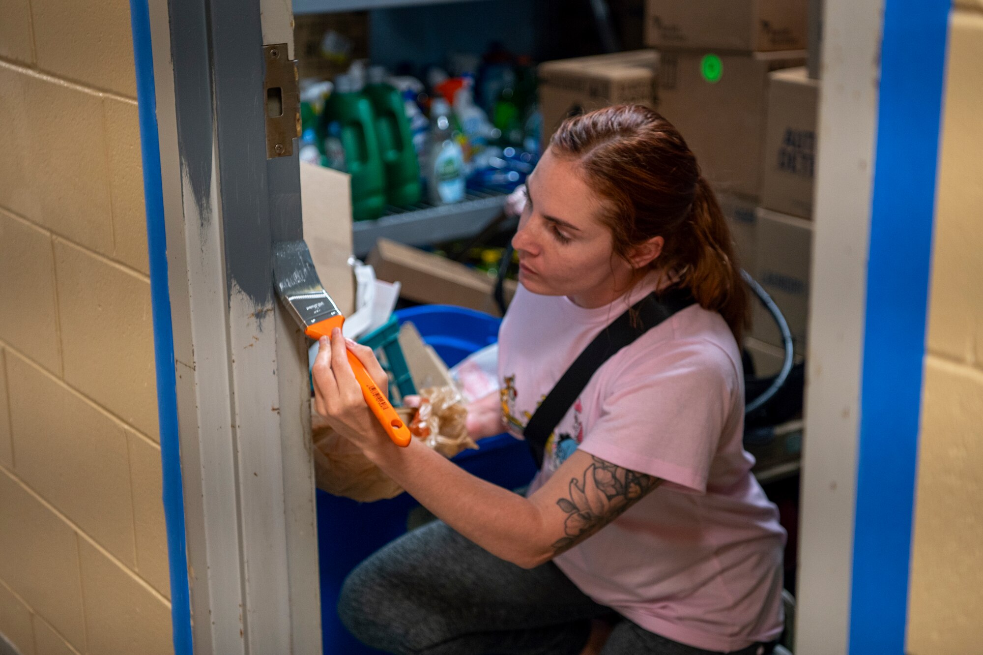 A U.S. Air Force Airman assigned to the 23rd Wing paints a door jamb at Lowndes Associated Ministries to People (LAMP) in Valdosta, Georgia, May 31, 2024. Moody Air Force Base volunteers helped freshen up the LAMP building by providing essential repairs to help the overall structural integrity. (U.S. Air Force photo by Airman 1st Class Leonid Soubbotine)