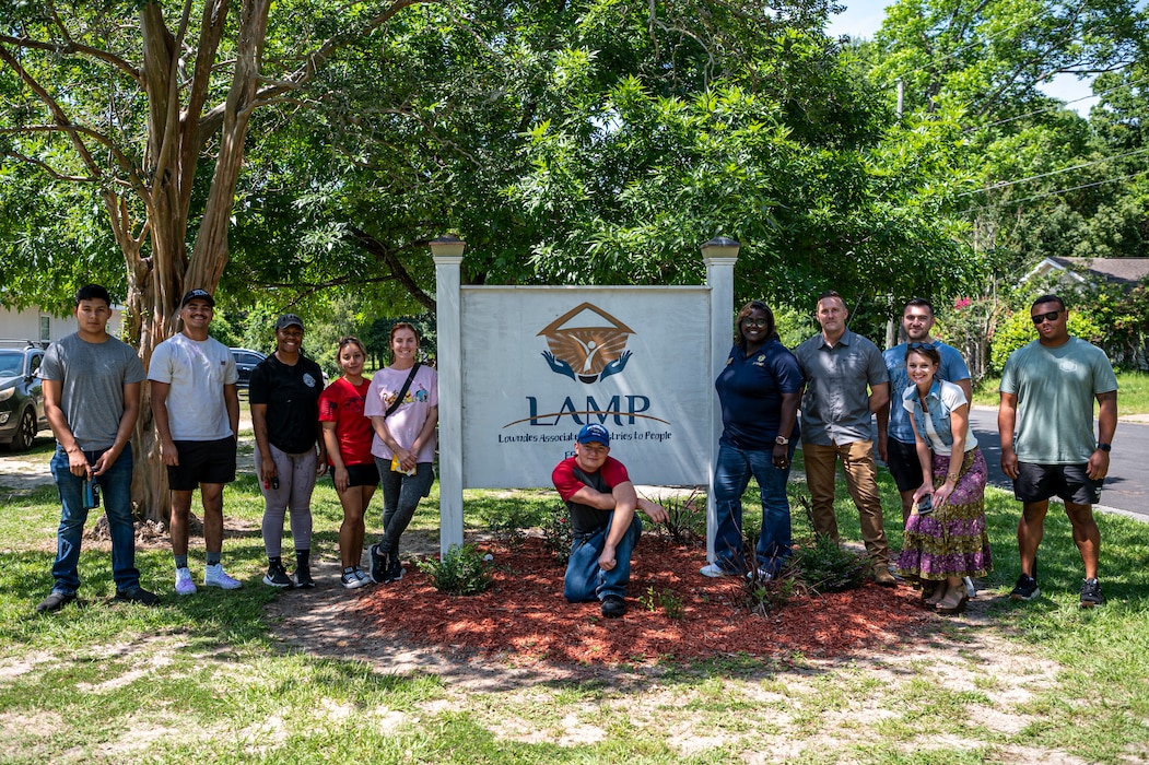 U.S. Air Force Airmen assigned to the 23rd Wing and Lowndes Associated Ministries to People (LAMP) staff pose for a photo in Valdosta, Georgia, May 31, 2024. Moody Air Force Base Airmen volunteered and participated in several projects to help the local community. (U.S. Air Force photo by Airman 1st Class Leonid Soubbotine)