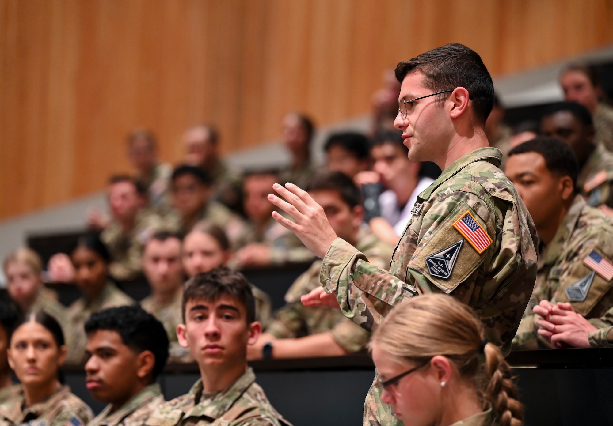 A cadet asks a question to U.S. Space Force Maj. Gen. Tim Sejba, Commander of Space Training and Readiness Command, during the first day of the Azimuth program at the U.S. Air Force Academy, in Colorado Springs, Colo., June 3, 2024. Azimuth is a unique summer program for U.S. Air Force Academy cadets as well as Navy and Army cadets, and ROTC students considering a commission in the U.S. Space Force. Azimuth is a three-week joint undergraduate nationwide space education and training program. Azimuth’s overall goal is to inspire men and women to become officers of character, motivated to lead in the Space Force. (U.S. Air Force photo by Capt. Charles Rivezzo)