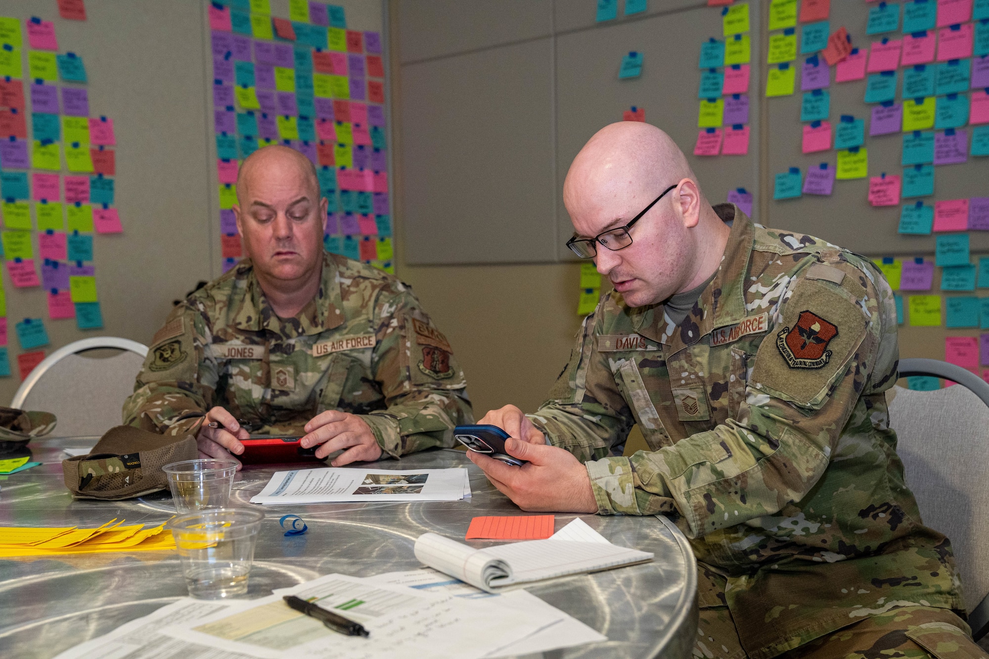 U.S. Air Force Senior Master Sgt. Steven Jones, 601st Air Operations Center Detachment 1 superintendent, and Master Sgt. Kenneth Davis, Air Force Career Development Academy command and control battle management operations learning engineer, work together at the occupational competency seminar on Keesler Air Force Base, Mississippi, March 19, 2024.