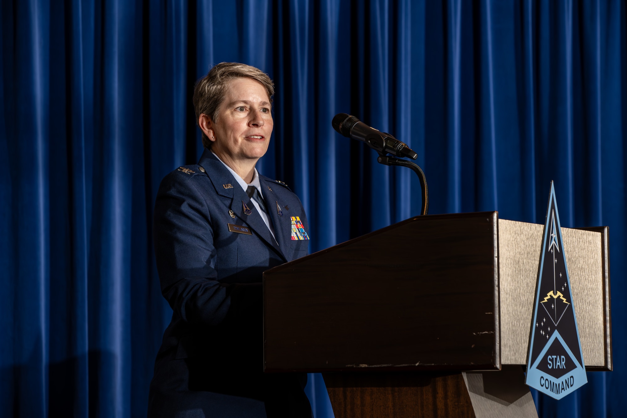 U.S. Space Force Col. Sacha Tomlinson, Space Delta 12 incoming commander, provides remarks after assuming command of Delta 12 during a change of command ceremony at Peterson Space Force Base, Colo., May 31, 2024. As the commander of Delta 12, Tomlinson leads the integrated test and evaluation of U.S. Space Force capabilities to rapidly field combat-credible weapon systems and tactics. (U.S. Space Force photo by Dalton Prejeant)