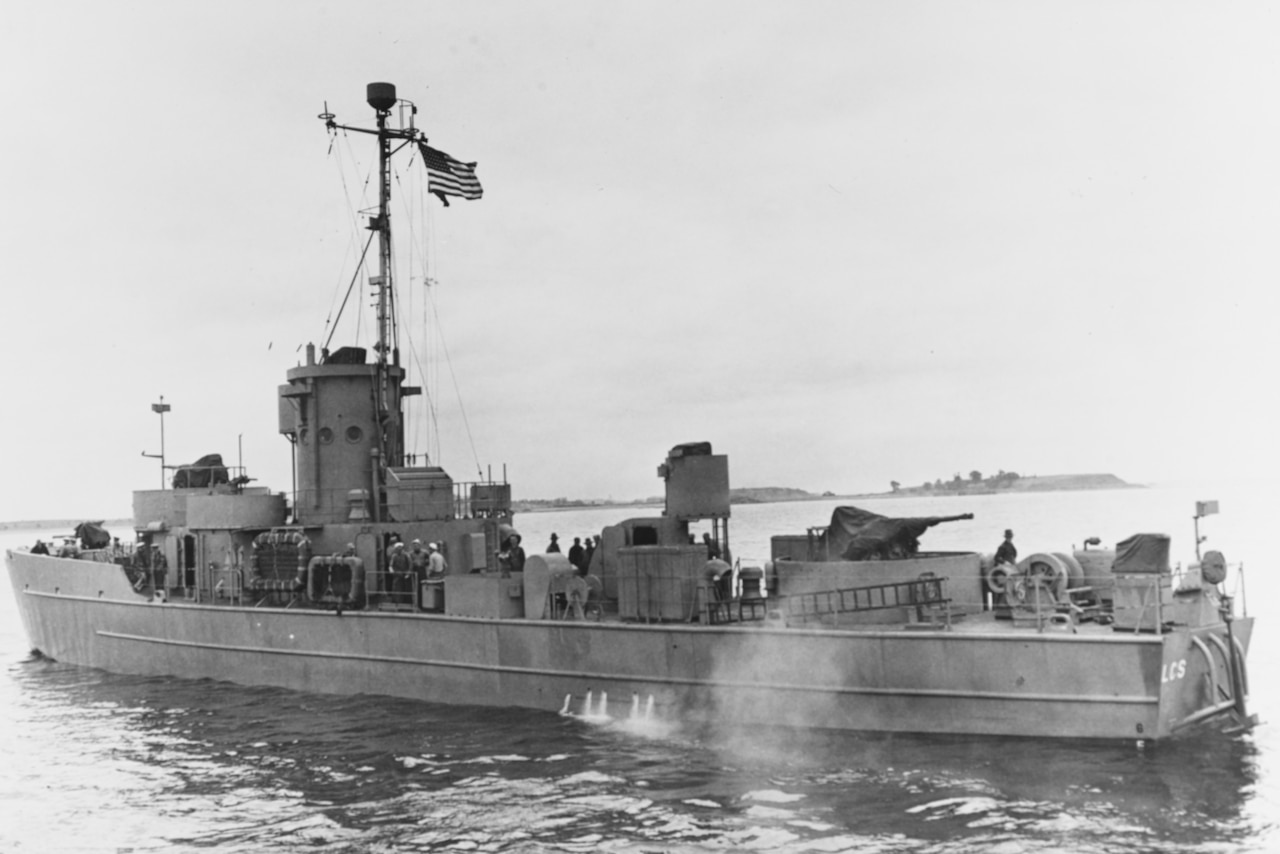A small ship sits in water.