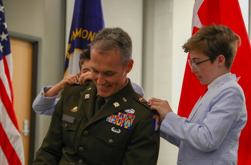 Kentucky Army National Guard Col. John Harvey was promoted during a ceremony in front of his family, friends, and colleagues inside the Wellman Auditorium at the Boone National Guard Center on May 24, 2024. (U.S. Army National Guard photo by Sgt. Destini Keene)