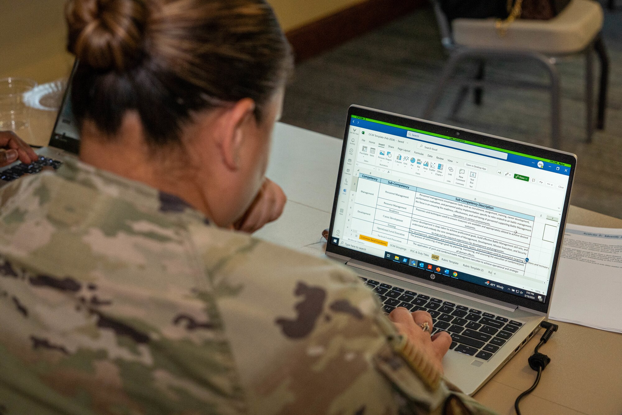 An U.S. Airmen studies different competency categories during the occupational competency seminar on Keesler Air Force Base, Mississippi, March 19, 2024.