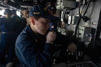 BREST, France (June 3, 2024) Boatswains Mate 3rd Class Cheyanne Armenta, assigned to the Harper’s Ferry-class amphibious landing dock USS Oak Hill (LSD 51), conducts a time check over the 1MC in the pilot house during sea and anchor detail aboard Oak Hill prior to the ship’s departure from Brest, France, June 3, 2024. Oak Hill is conducting operations in U.S. Naval Forces Europe area of operations as part of the Wasp Amphibious Ready Group (WSP ARG)-24th Marine Expeditionary Unit (MEU) Special Operations Capable (SOC). The WSP ARG-24th MEU (SOC) support high-end warfighting exercises while demonstrating speed and agility operating in a dynamic security environment. (U.S. Navy photo by Mass Communication Specialist 3rd Class Justin Kemble)