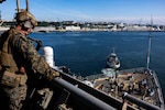BREST, France (June 3, 2024) Lance Cpl. Warembourg, assigned to the 24th Marine Expeditionary Unit (MEU) Special Operations Capable (SOC), provides security from the bridge wing of Harper’s Ferry-class amphibious landing dock USS Oak Hill (LSD 51) while the ship’s Sailors perform sea and anchor detail on the fo’c’sle during Oak Hill’s departure from Brest, France, June 3, 2024. Oak Hill is conducting operations in U.S. Naval Forces Europe area of operations as part of the Wasp Amphibious Ready Group (WSP ARG)-24th Marine Expeditionary Unit (MEU) Special Operations Capable (SOC). The WSP ARG-24th MEU (SOC) support high-end warfighting exercises while demonstrating speed and agility operating in a dynamic security environment. (U.S. Navy photo by Mass Communication Specialist 3rd Class Justin Kemble)