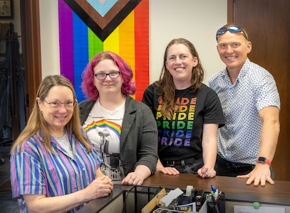 The Puget Sound Naval Shipyard & Intermediate Maintenance Facility PRIDE Employee Resource Group co-leads include (from left) Marcie Mathis, Kendra Schaff, Dana Honstain and Wes HansonSmith, pictured here May 23, 2024, in Bremerton, Washington. (U.S. Navy photo by Wendy Hallmark)