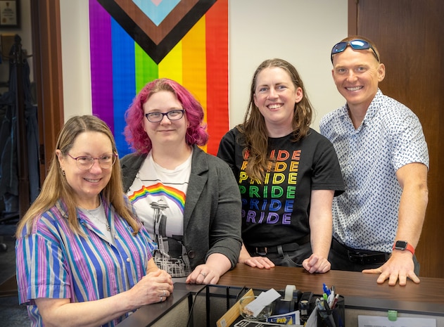 The Puget Sound Naval Shipyard & Intermediate Maintenance Facility PRIDE Employee Resource Group co-leads include (from left) Marcie Mathis, Kendra Schaff, Dana Honstain and Wes HansonSmith, pictured here May 23, 2024, in Bremerton, Washington. (U.S. Navy photo by Wendy Hallmark)