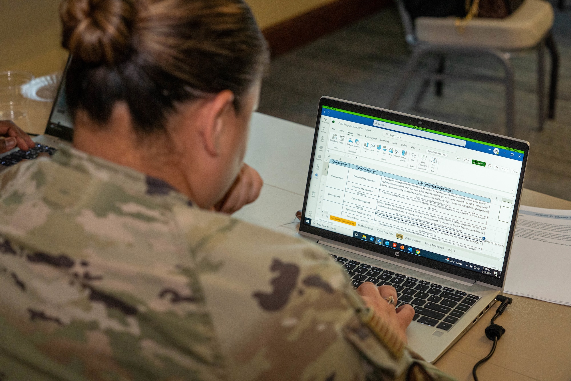 An U.S. Airmen studies different competency categories during the occupational competency seminar on Keesler Air Force Base, Mississippi, March 19, 2024.