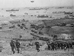 The build-up of Omaha Beach. Reinforcements of men and equipment moving inland. Photo courtesy of Center of Military History.