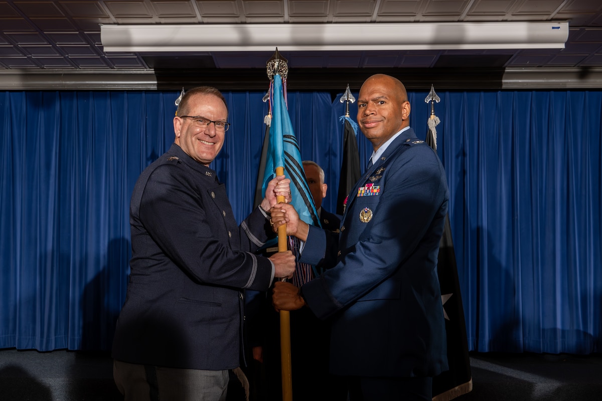 U.S. Space Force Col. E. Lincoln Bonner, Space Delta 12 outgoing commander, right, relinquishes command of Delta 12 during a change of command ceremony at Peterson Space Force Base, Colorado, May 31, 2024. (U.S. Space Force photo by Dalton Prejeant)