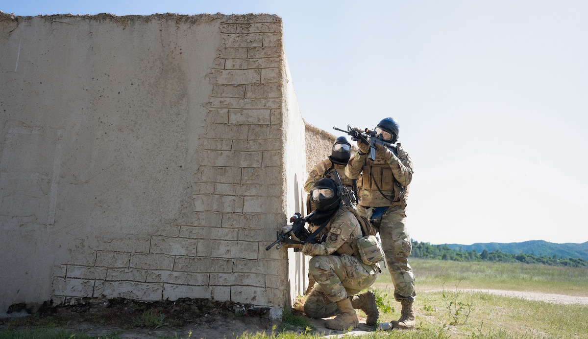 Airmen with the 821st Contingency Response Squadron prepare to clear buildings during Exercise HADES SENTINEL at Fort Hunter-Liggett in Jolon, California, May 1, 2023.