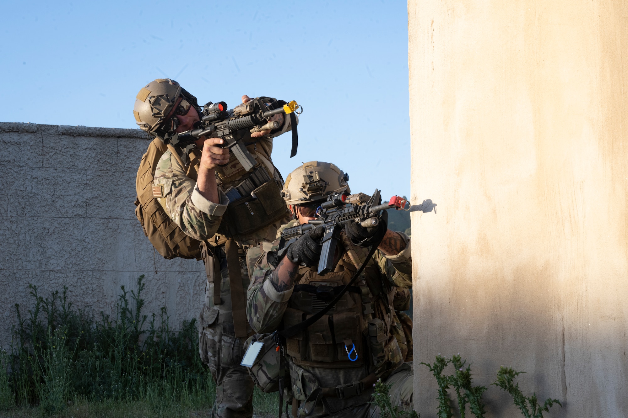 Tech. Sgt. Christopher Edginton, 821st Contingency Response Squadron advanced assessment team leader, and U.S. Staff Sgt. Eli De La Torre, 821st CRS fire team member, clear buildings together during Exercise HADES SENTINEL, May 2, 2024.