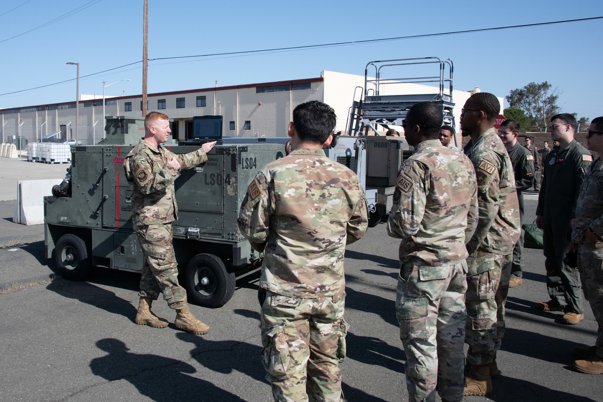 equipment instructor demonstrates air cart operations to personnel
